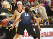 Cassidy Gardner of Prairie tries to navigate around Skyview's Remington Riley at a basketball game in Vancouver Tuesday December 13, 2016.