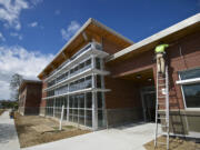 Workers scramble to finish a new building at Ridgefield High School the day before the start of classes in September 2014. A bond issue likely to go before voters in February 2019 would most likely be used to build a new K-4 school and for additional expansions at Ridgefield High School, Superintendent Nathan McCann said.