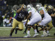 Washington defensive lineman Vita Vea, left, lines up against Oregon in the first half of an NCAA college football game, Saturday, Nov. 4, 2017, in Seattle. (AP Photo/Ted S.