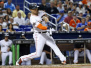 A person familiar with the negotiations says the New York Yankees and Miami Marlins are working on a trade that would send slugger Giancarlo Stanton to New York and infielder Starlin Castro to Miami.  The person spoke to The Associated Press on condition of anonymity Saturday, Dec. 9, 2017, because no agreement has been completed.