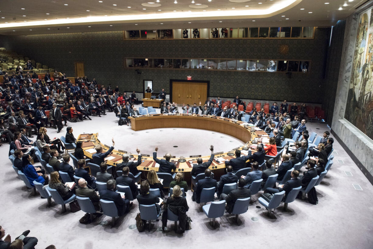 In this Monday, Dec. 18, 2017 photo, the Security Council votes on a resolution concerning Jerusalem's status at United Nations headquarters. The United States on Monday vetoed a resolution supported by the 14 other U.N. Security Council members that would have required President Donald Trump to rescind his declaration of Jerusalem as the capital of Israel, a vote that showed the depth of global opposition to the U.S. move.