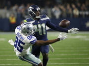 Seattle Seahawks cornerback Byron Maxwell (41) breaks up a pass intended for Dallas Cowboys' Noah Brown (85) in the second half of an NFL football game, Sunday, Dec. 24, 2017, in Arlington, Texas. Maxwell was charged with pass interference on the play.