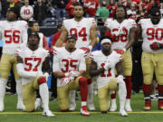 President Donald Trump's feud with the NFL about players kneeling during the national anthem is the runaway winner for the top sports story of 2017 in balloting by AP members and editors.  (AP Photo/David J.