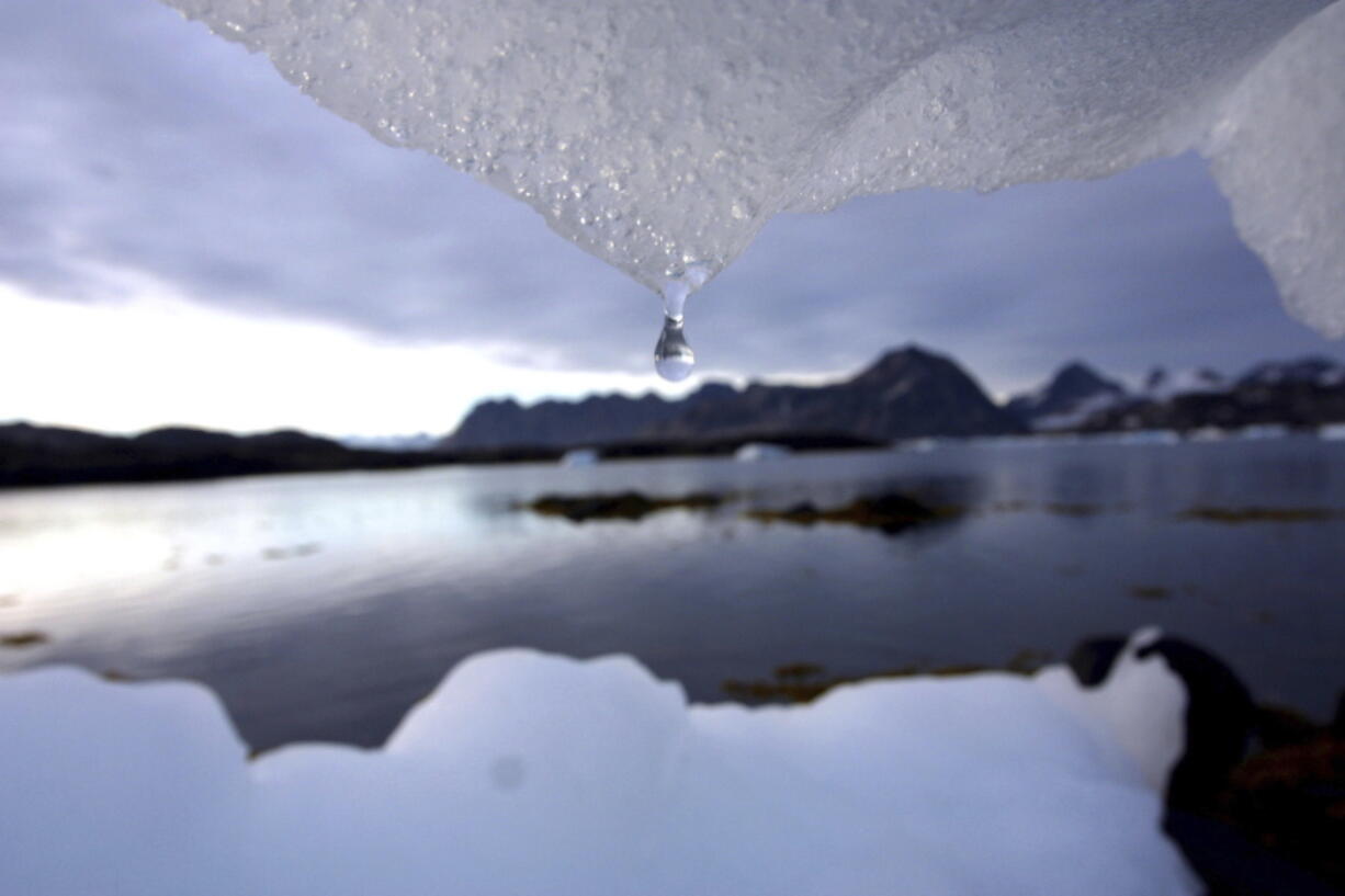 An iceberg melts in Kulusuk, Greenland near the arctic circle. A new report finds permafrost in the Arctic is thawing faster than ever before. The annual report card released Tuesday also finds water is warming and sea ice is melting at the fastest pace in 1,500 years at the top of the world.