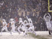 Army celebrates after defeating Navy in an NCAA college football game, Saturday, Dec. 9, 2017, in Philadelphia. Army won 14-13.