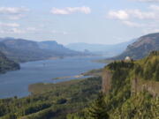 This file photo taken Thursday, May 12, 2011, shows the Columbia River near Corbett, Ore. Politicians from both major U.S. parties are praising a decision to start negotiations early next year over the future of a treaty between America and Canada that governs hydropower and flood control operations along the Columbia River, which starts in British Columbia and flows into the U.S., eventually ending at the Pacific Ocean.