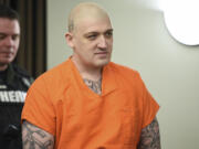 Triple murderer Brent Luyster appears in Clark County Superior Court Monday for his sentencing, which was delayed until Dec. 15 by Judge Robert Lewis.