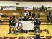 The Skyview Storm pose with the bracket after winning the Capitol City Classic at Willamette University on Friday night. The Storm beat Mater Dei Catholic, 66-63.