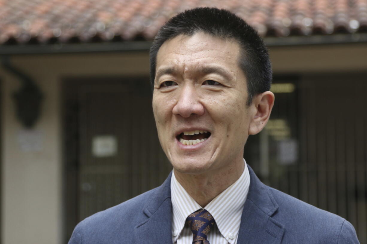 In this Oct. 17, 2017, file photo, Hawaii Attorney General Douglas Chin speaks to The Associated Press about Hawaii’s lawsuit challenging President Donald Trump’s travel ban in Honolulu. A federal appeals court panel ruled Friday, Dec. 22, 2017, that President Trump once again exceeded the scope of his authority with his latest travel ban. However, the 9th U.S. Circuit Court of Appeals judges put their decision on hold pending review by the U.S. Supreme Court, meaning the ban involving six majority Muslim countries will remain in effect.