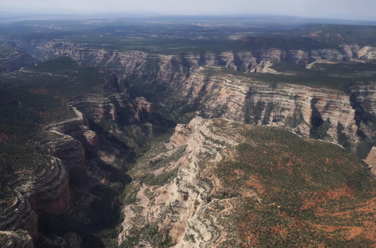 FILE - This May 8, 2017, file photo. shows Arch Canyon within Bears Ears National Monument in Utah. President Donald Trump’s decision to drastically reduce and break up a national monument in Utah wasn’t the only blow Native American tribes say they were dealt last week. The proclamation Trump signed changes the makeup of a tribal advisory commission for Bears Ears National Monument. It adds a San Juan County, Utah, commissioner who supported peeling back protections for the land.