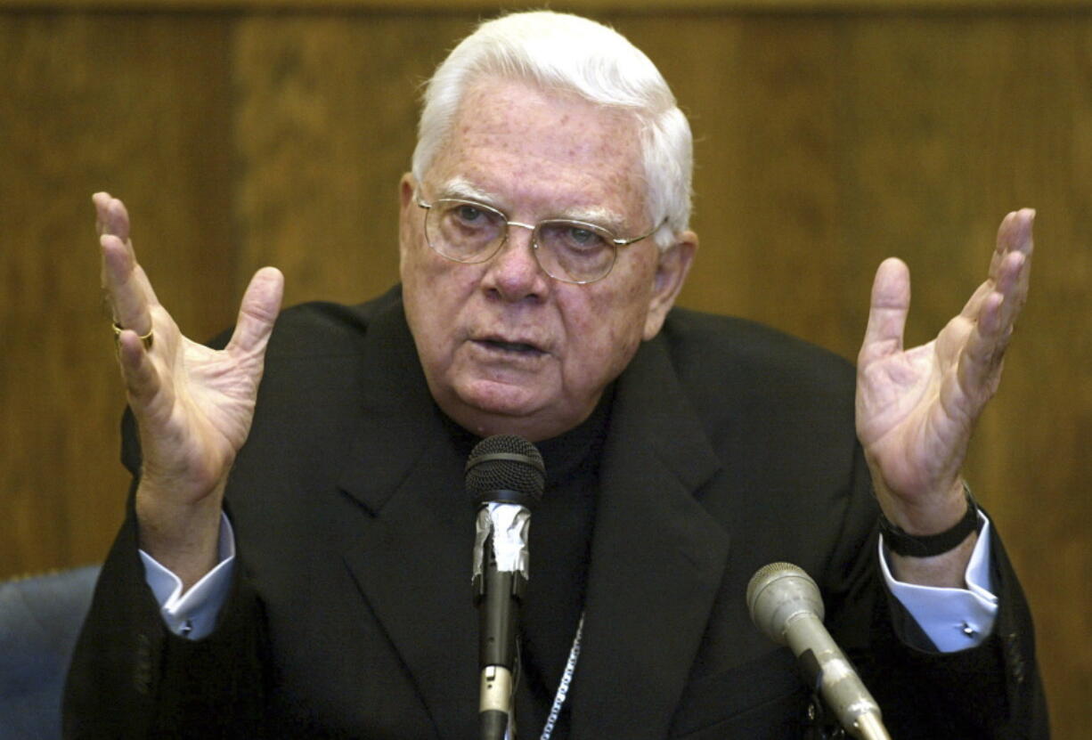 Cardinal Bernard Law, of the Boston archdiocese of the Roman Catholic Church, testifies in 2002 in Suffolk Superior Court in Boston. Law was answering questions about his knowledge and handling of the Father John Geoghan child sex abuse case. Law died Wednesday at 86.