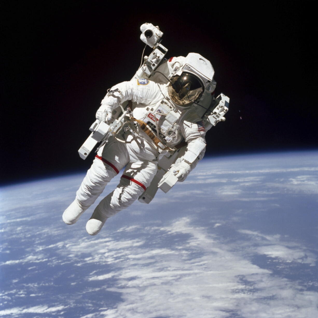 This Feb. 7, 1984 photo made available by NASA shows astronaut Bruce McCandless II, participating in a spacewalk a few meters away from the cabin of the Earth-orbiting space shuttle Challenger, using a nitrogen-propelled Manned Maneuvering Unit. The Johnson Space Center says McCandless died Thursday, Dec. 21, 2017 in California.