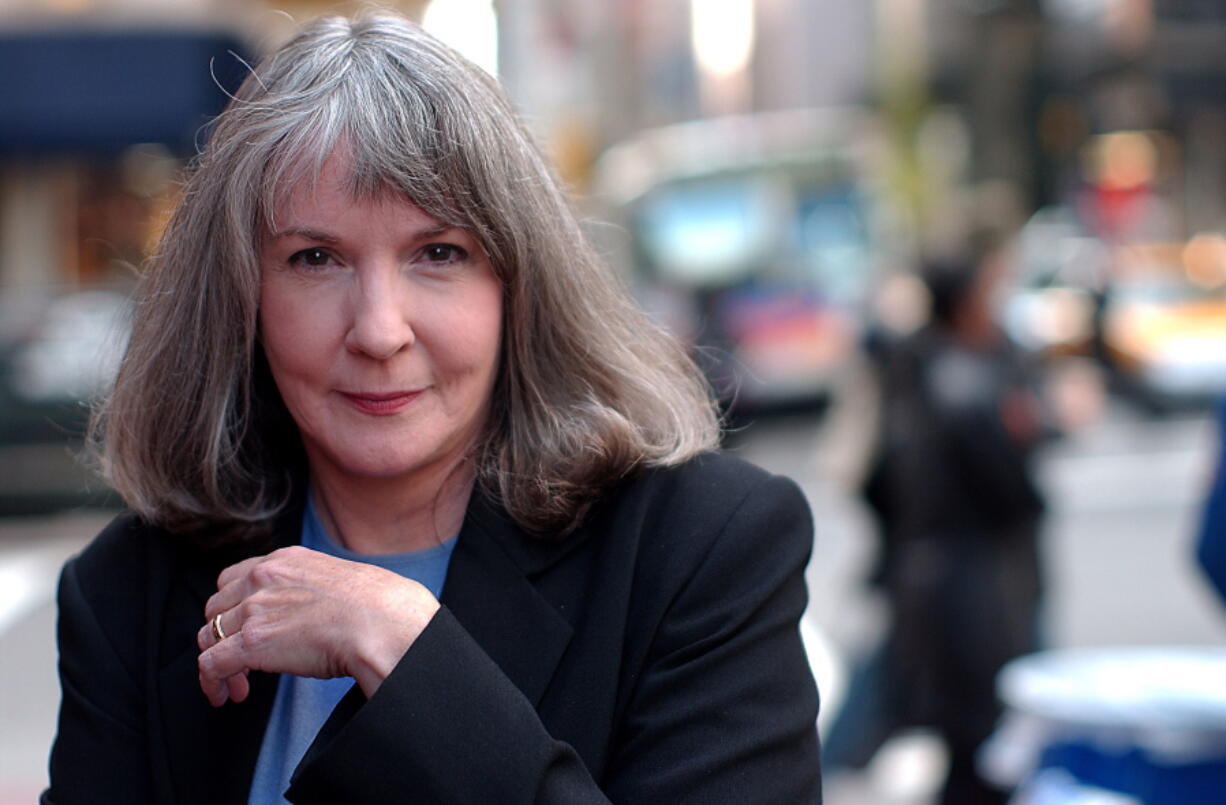 FILE - In this Oct. 15, 2002 file photo, mystery writer Sue Grafton poses for a portrait in New York. Grafton has died in Santa Barbara, Calif., at the age of 77. Her daughter, Jamie Clark says her mother passed away Thursday night, Dec. 28, 2017, after a two-year battle with cancer and was surrounded by family.