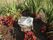 Teresa Marble placed this remembrance rock, symbolizing cancer fighters and survivors, on a stump in her yard in August. Sometime before Thanksgiving, the rock disappeared.