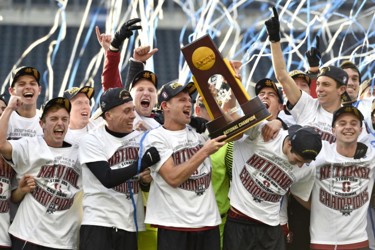 Members of the Stanford soccer team celebrate after winning the NCAA College Cup championship soccer match against Indiana, Sunday, Dec. 10, 2017, in Chester, Pa.