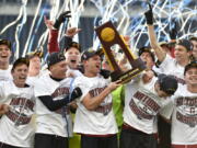 Members of the Stanford soccer team celebrate after winning the NCAA College Cup championship soccer match against Indiana, Sunday, Dec. 10, 2017, in Chester, Pa.