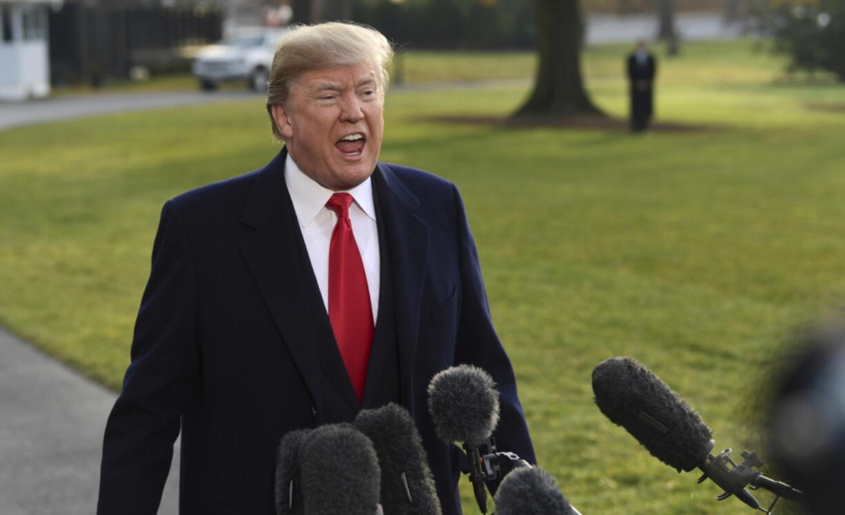 President Donald Trump speaks to reporters before boarding Marine One on the South Lawn of the White House in Washington, Monday before heading to Utah. Trump will be announcing plans to scale back two sprawling national monuments in Utah, responding to what he has condemned as a “massive federal land grab” by the government.