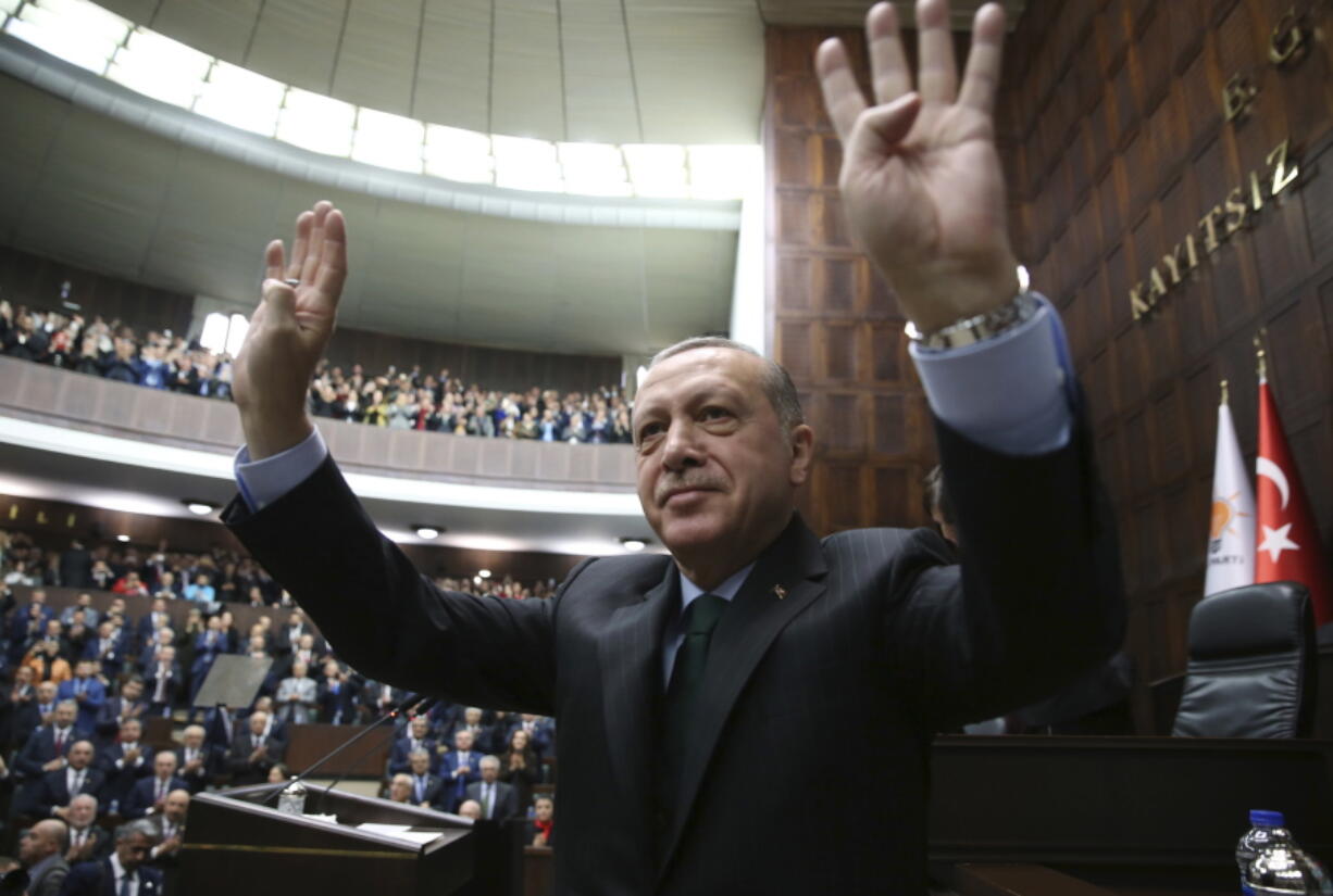 Turkey's President Recep Tayyip Erdogan waves as he arrives to deliver a speech during a meeting of his ruling Justice and Development Party (AKP), in Ankara, Turkey, Tuesday, Dec. 5, 2017. Erdogan says U.S. recognition of Jerusalem as Israel's capital is a 'red line' for Muslims and also said such a step would lead Turkey to cut off all diplomatic ties with Israel.