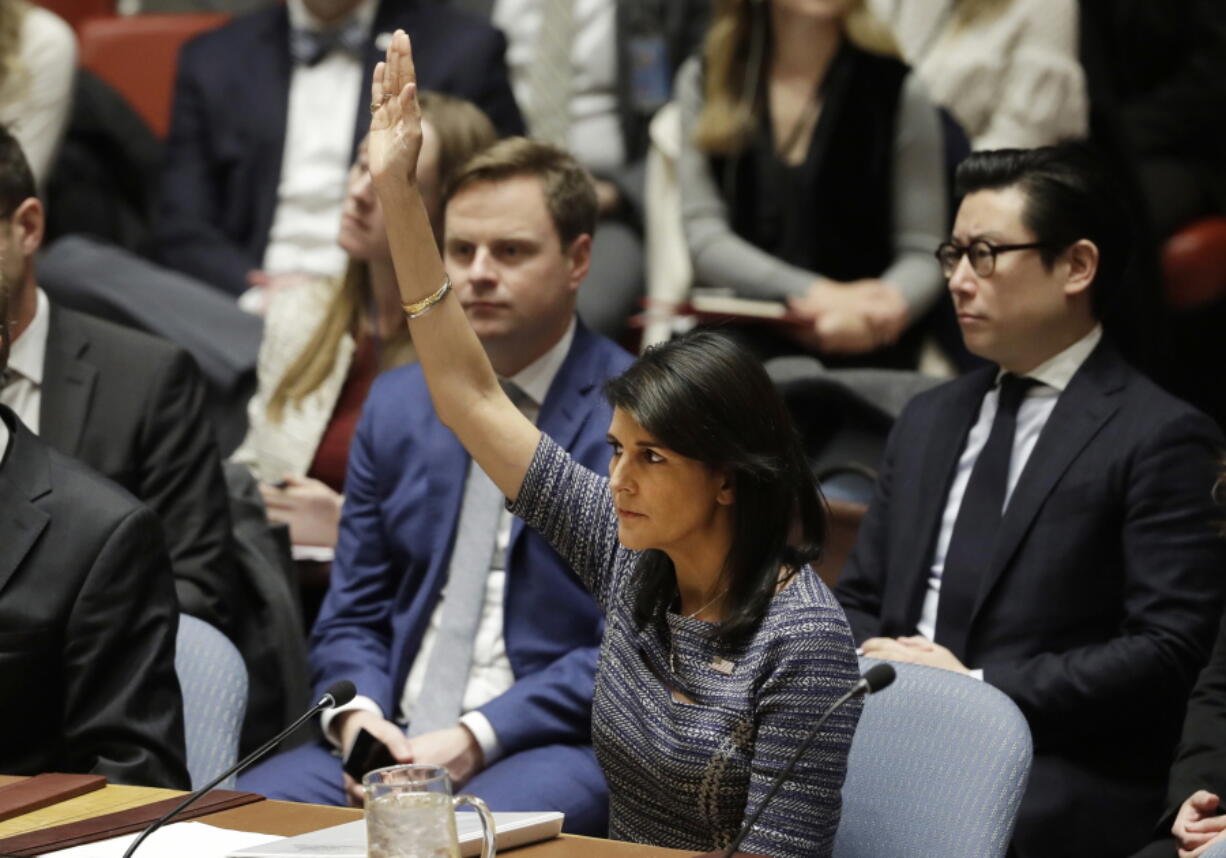 U.S. Ambassador Nikki Haley votes in favor of a resolution, Friday, Dec. 22, 2017, at United Nations headquarters. The Security Council is voting on proposed new sanctions against North Korea, including sharply lower limits on its refined oil imports, the return home of all North Koreans working overseas within 12 months, and a crackdown on the country’s shipping.