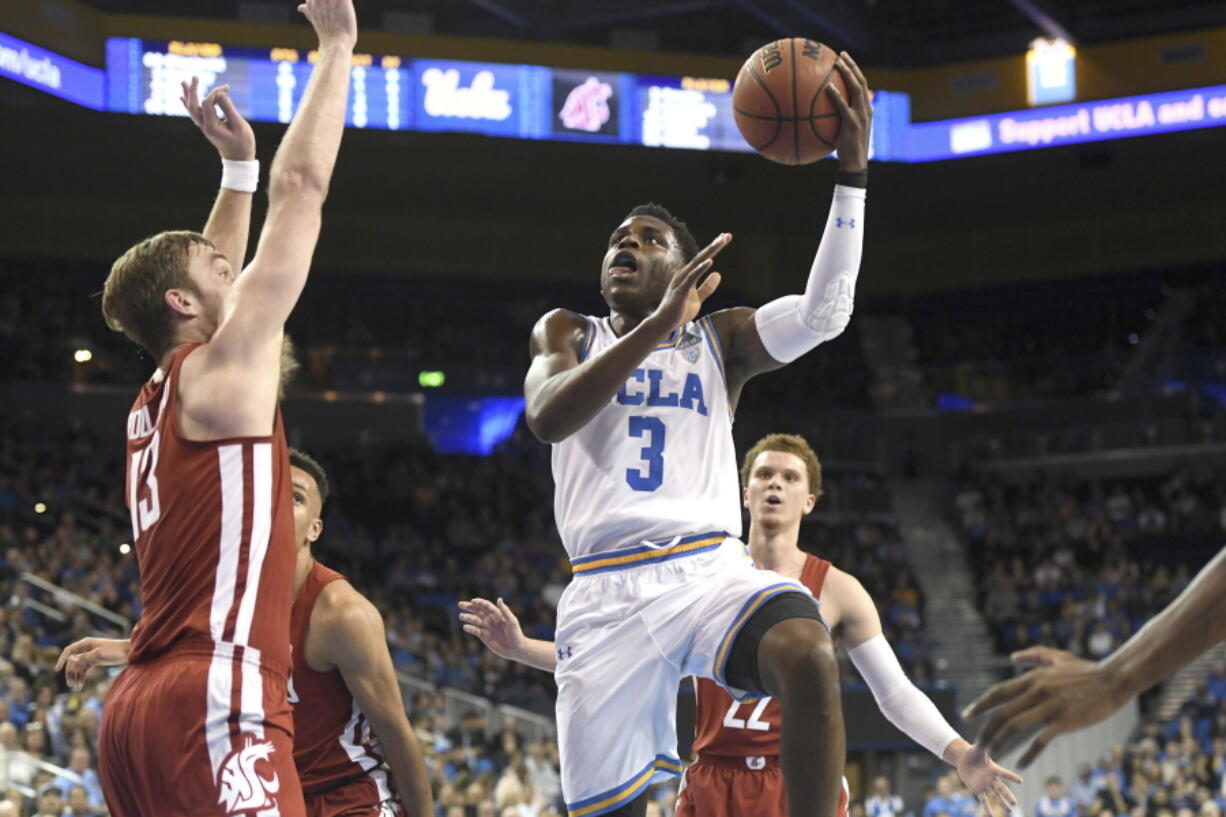 UCLA’s Aaron Holiday (3) drives to the basket against Washington State during the first half of an NCAA college basketball game Friday, Dec. 29, 2017, in Los Angeles.