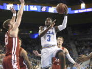 UCLA’s Aaron Holiday (3) drives to the basket against Washington State during the first half of an NCAA college basketball game Friday, Dec. 29, 2017, in Los Angeles.