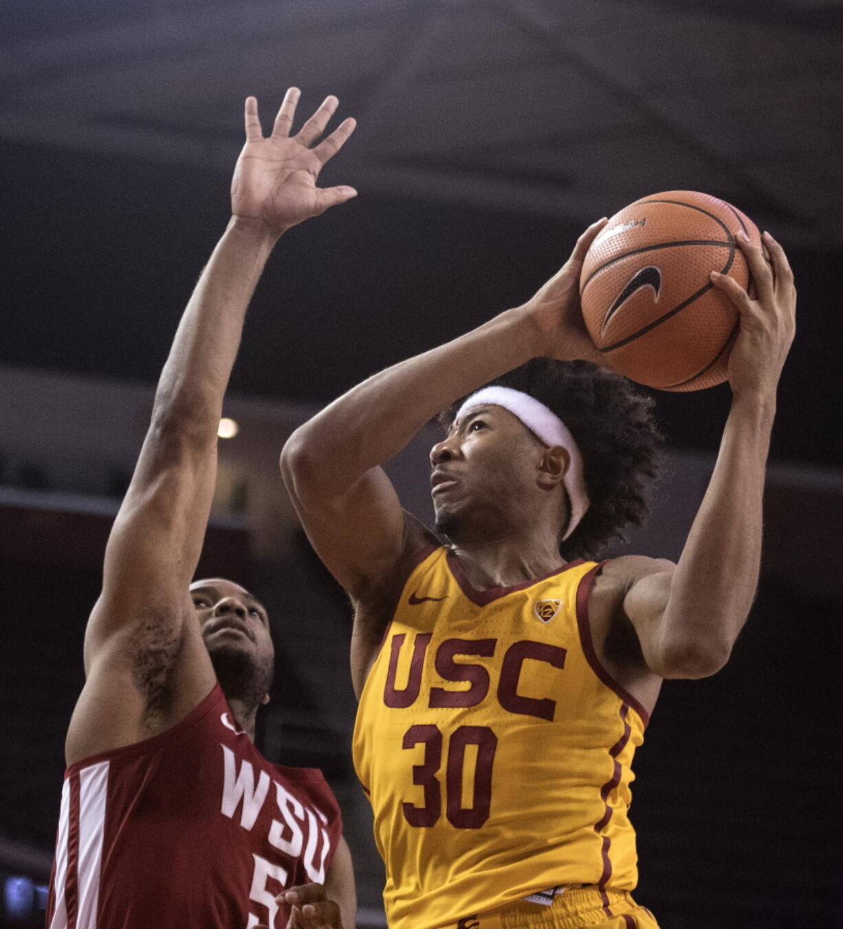 Southern California guard Elijah Stewart, right, goes up for a basket as Washington State guard Milan Acquaah defends during the second half of an NCAA college basketball game Sunday, Dec. 31, 2017, in Los Angeles.