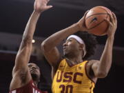 Southern California guard Elijah Stewart, right, goes up for a basket as Washington State guard Milan Acquaah defends during the second half of an NCAA college basketball game Sunday, Dec. 31, 2017, in Los Angeles.