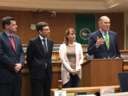 Gov. Jay Inslee speaks at a press conference on Thursday in Olympia. From right are state Rep. David Sawyer, D-Tacoma, state Attorney general Bob Ferguson and Sen. Ann Rivers, R-La Center.