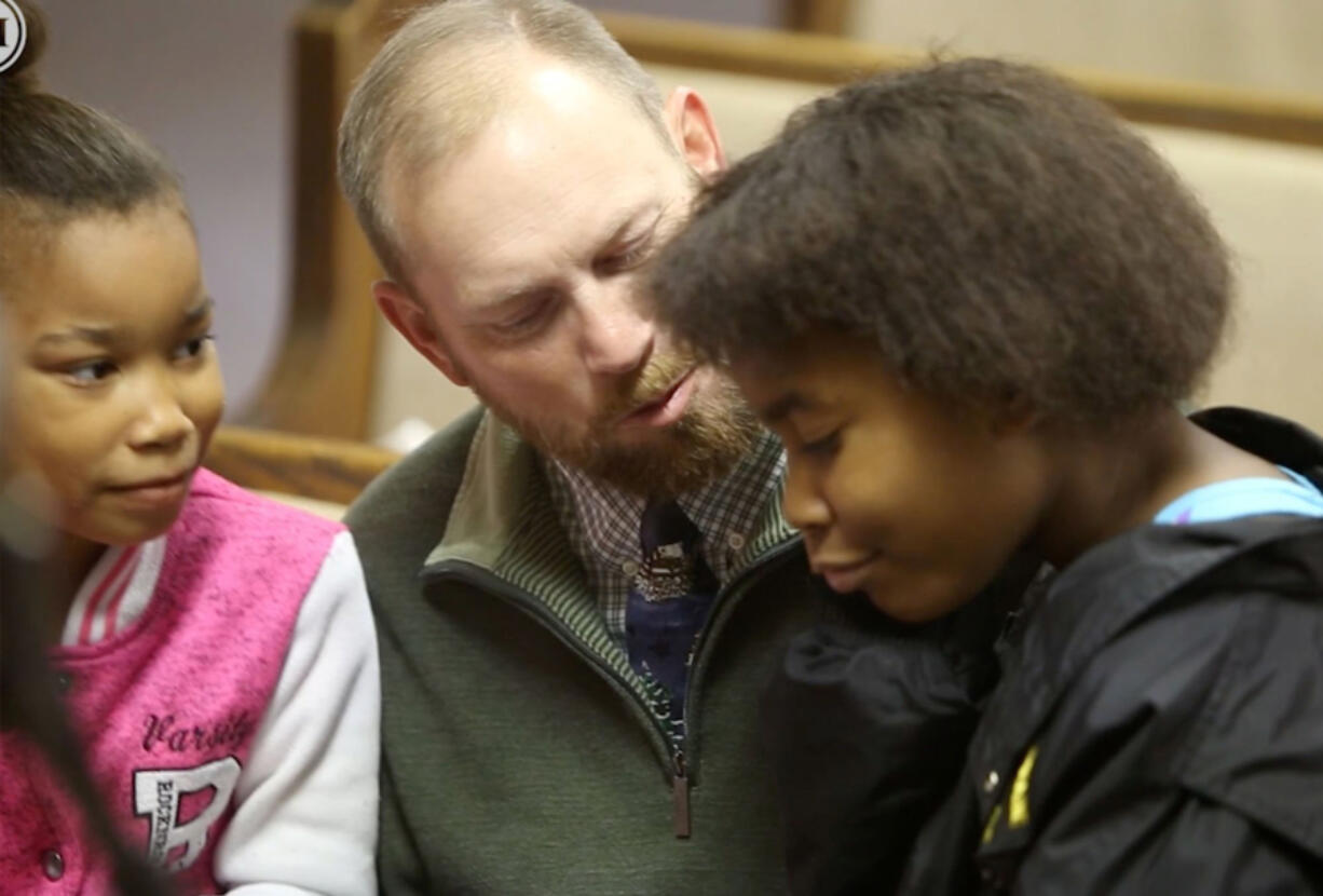 Joey Gilbert of Carnesville, Ga., talks to Alasjah Haynes, 7, of Waveland, and her sister, Jada, 12, before services at Bayside Baptist Church in Waveland on Sunday, Dec. 17, 2017.