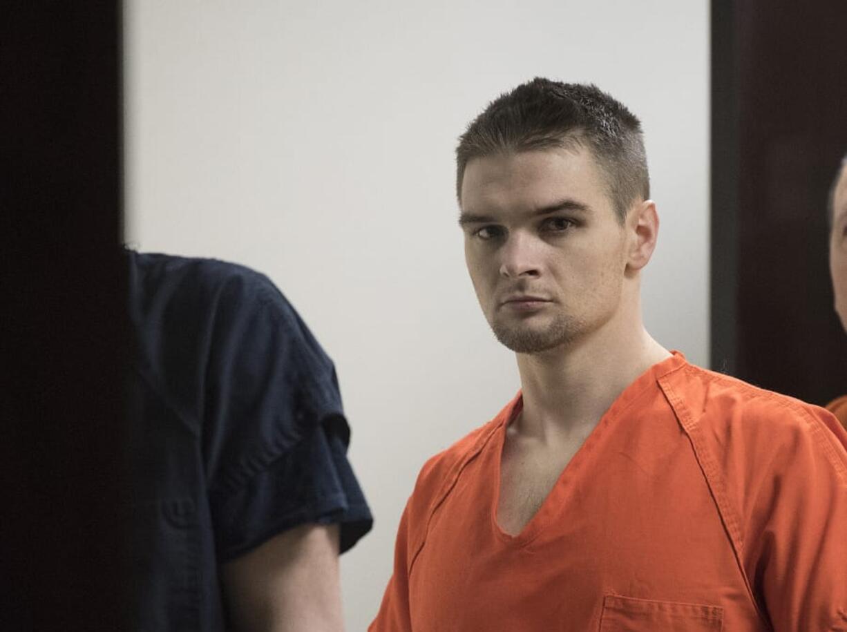 Joshua Roland, a suspect in a Christmas Eve burglary and arson in Hockinson, leaves the courtroom after making a first appearance Jan. 10 in Clark County Superior Court. Roland was arraigned Wednesday on multiple charges.