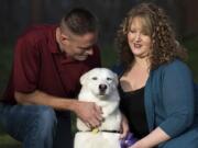 Eric and Tonya Imhoff sit with their new husky Jasmine. In mid-December, she’d only been with the couple for about a month, but they said she’d been fitting in just fine.