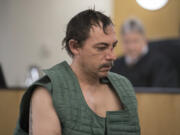 Robert W. Clark, 42, makes a first appearance Tuesday in Clark County Superior Court. He is accused of brutally attacking his wife Sunday night at a Vancouver hotel.