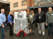 Central Vancouver: Innovative Services NW received 50 computers from Free Geek, which were delivered on Nov. 28. From left: Jim Lodwick, facilities manager with Innovative, Dena Strong, Innovative’s vice president of client services, Durran Champie of Free Geek, Derek Barkdoll, system administrator with Innovative, and Dylan Barkdoll, Innovative volunteer.