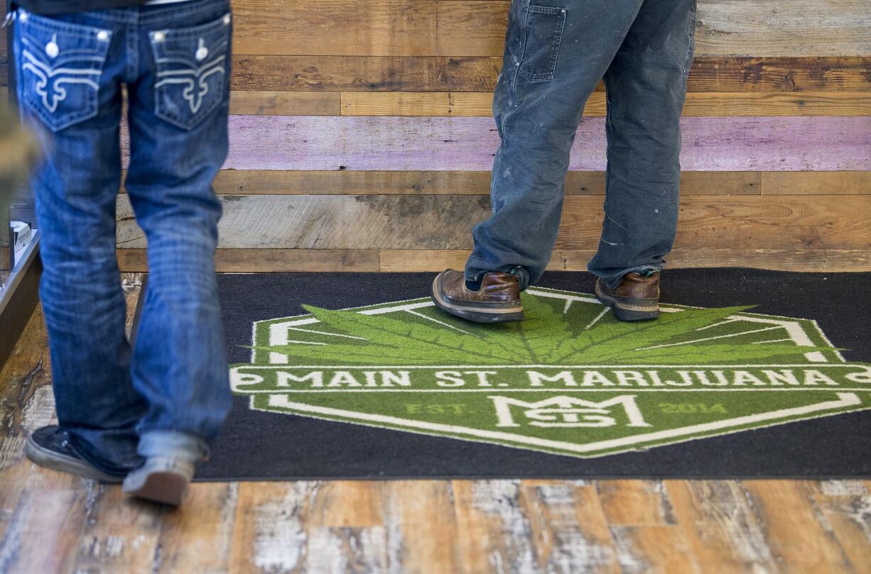 Customers shop for marijuana and related products at Main Street Marijuana on Thursday morning, Jan. 4, 2018.