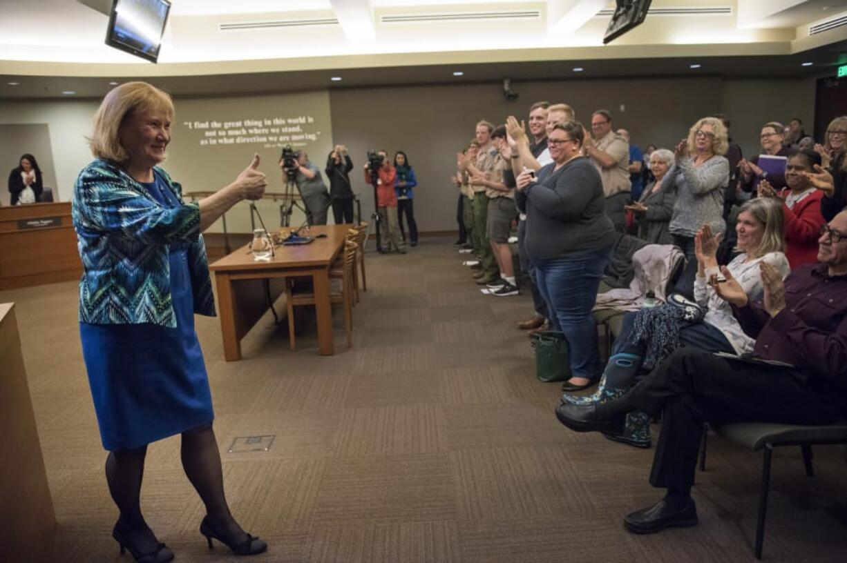 The crowd gives Vancouver Mayor Anne McEnerny-Ogle a standing ovation after she is sworn in during the first city council meeting of the year at City Hall in Vancouver on Monday.