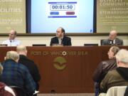 Port of Vancouver’s board of commissioners from left, Don Orange, Eric LaBrant and Jerry Oliver, listen to public statements during a board meeting where commissioners voted unanimously to put an end date on Vancouver Energy’s rolling lease for a proposed oil terminal, Tuesday January 9, 2018, at the Port of Vancouver.