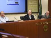 Port of Vancouver Commissioners Don Orange, from left, Eric LaBrant and Jerry Oliver listen to public statements during a board meeting.