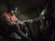 Cavers explore a cave near Mount St.