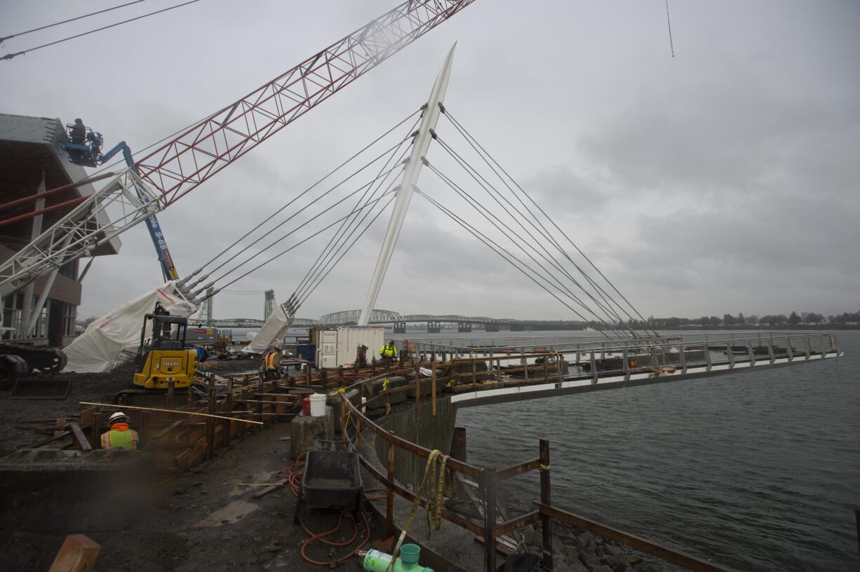 Construction continues at the Grant Street Pier, which recently had its pilings removed and is now floating over the Columbia River by its own cables, Thursday morning, Jan. 11, 2018.