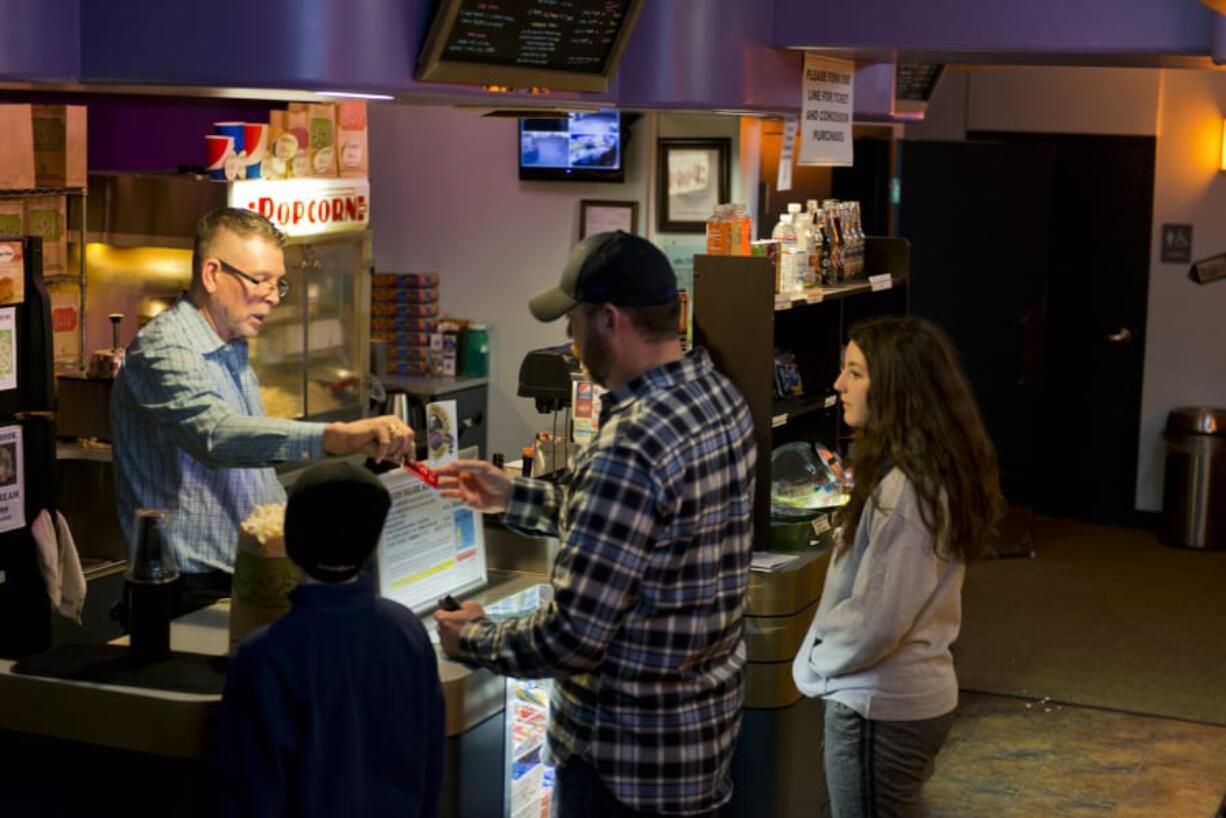 Attendance has ticked up slightly at The Liberty Theatre in Camas, said Managing Director Rand Thornsley, left, which he attributes to the growing popularity of MoviePass. Still, he wonders if the service can last.