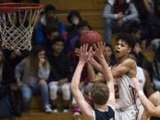 Fort Vancouver's Johnny Green eyes the basket for a shot during Friday night's game against Kelso at Fort Vancouver High School on Jan. 12, 2018.