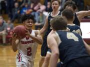 Fort Vancouver’s Johnny Green (2) moves toward the basket during the final seconds of Friday night’s game against Kelso. Green was called for a charge on the play, allowing the Hilanders to seal the victory.