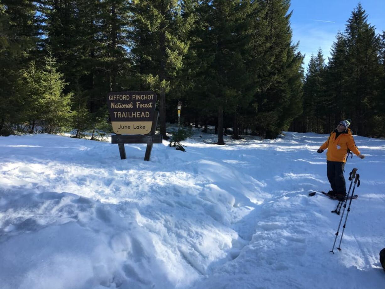 Winter recreationalists gear up for a snowshoeing trip into the woods near June Lake on the south side of Mount St. Helens. Snowpack levels in the Lower Columbia River Basin are currently the lowest in the state.