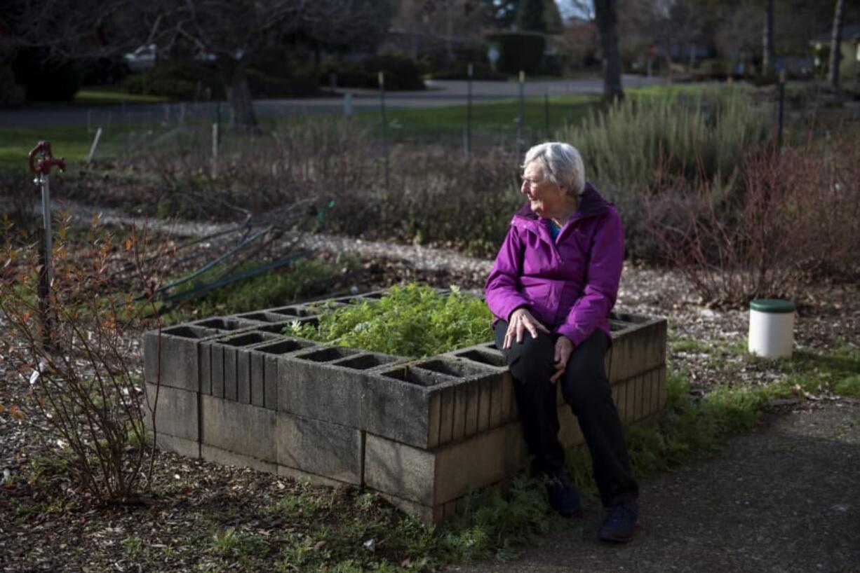 Wanda Wilson of Vancouver sits on a raised, wheelchair-accessible garden bed at the Minnie Stromgren Memorial Garden at Vancouver Heights United Methodist Church. Wilson spearheaded the launch of the community garden project in 2009, and the space now has 34 plots. If gardeners produce more food then they can use, they donate extra produce to Share or to the families at the church’s child care program.