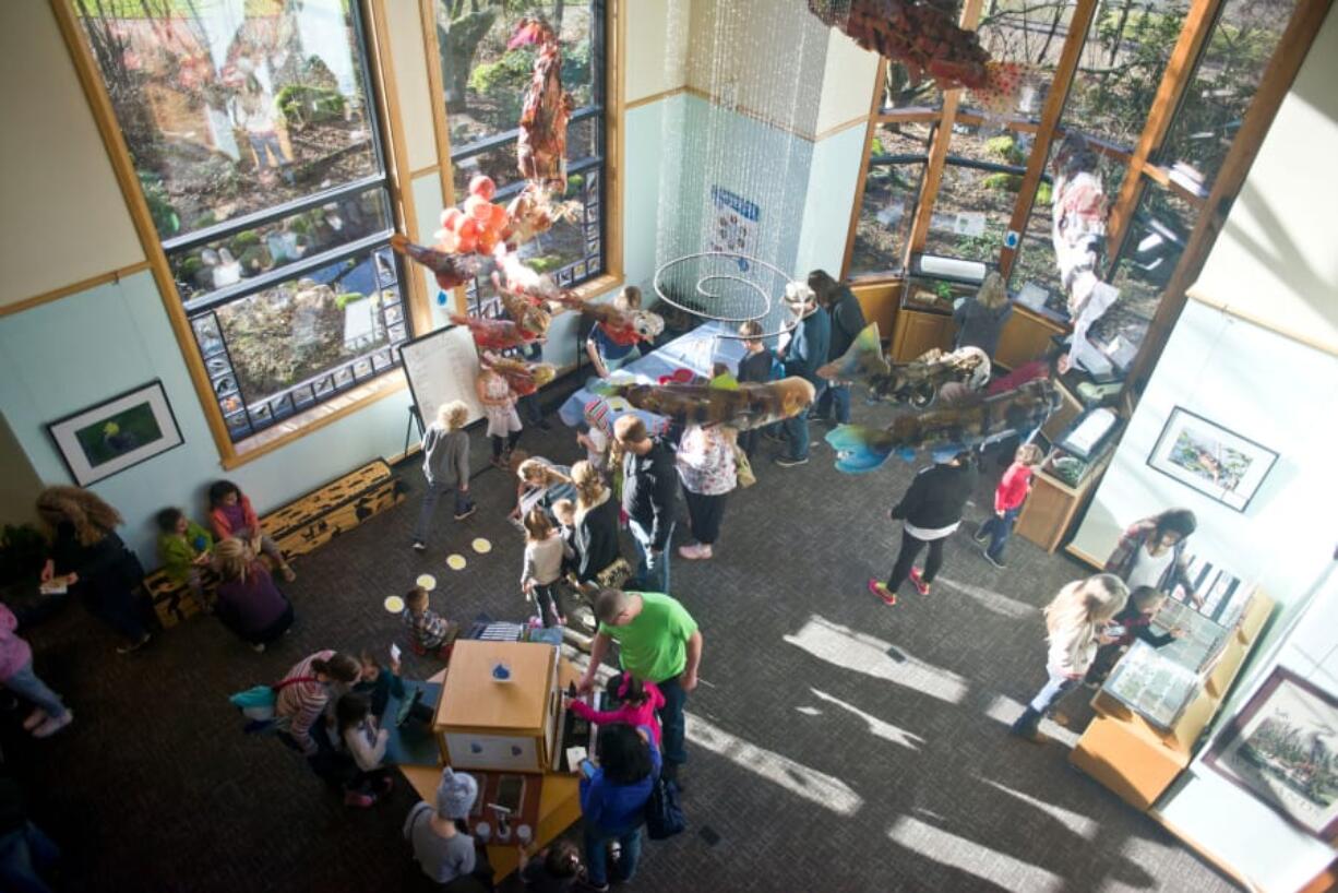 People mill around a series of science-based activities during a Second Saturday event called “Be a Scientist!” at the Water Resource Education Center Saturday. The Water Resource Education Center hosts hands-on learning opportunities for kids and their families every second Saturday of the month.