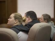 Skylar Stevens of Washougal, left, joins her mom, Melissa Stevens, right, as they prepare to be sentenced in Clark County Superior Court on Friday for the death of their dog. Both women will be screened to see if they are eligible for work release confinement.