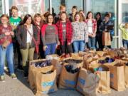 Woodland: Woodland High School’s Interact Club and other student volunteers assisted with Woodland Rotary Club’s annual Christmas Giving Program by buying clothes, food and gifts for more than 100 families.