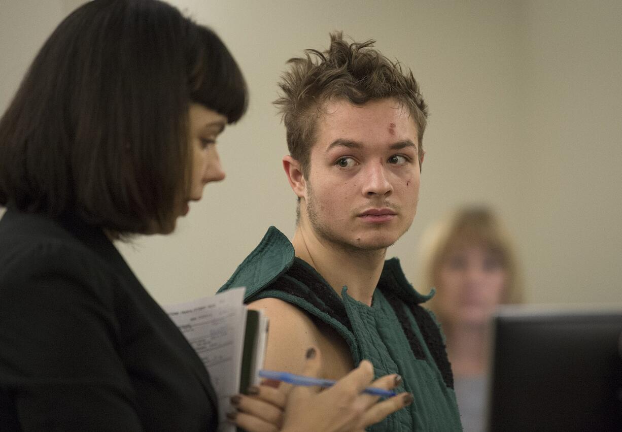 Colin Dixon makes a first appearance in Clark County Superior Court on Friday morning, Jan. 19, 2018. (Amanda Cowan/The Columbian) Colin Dixon, 21, of Battle Ground appeared in Clark County District Court on charges stemming from an alleged knife attack on his family.