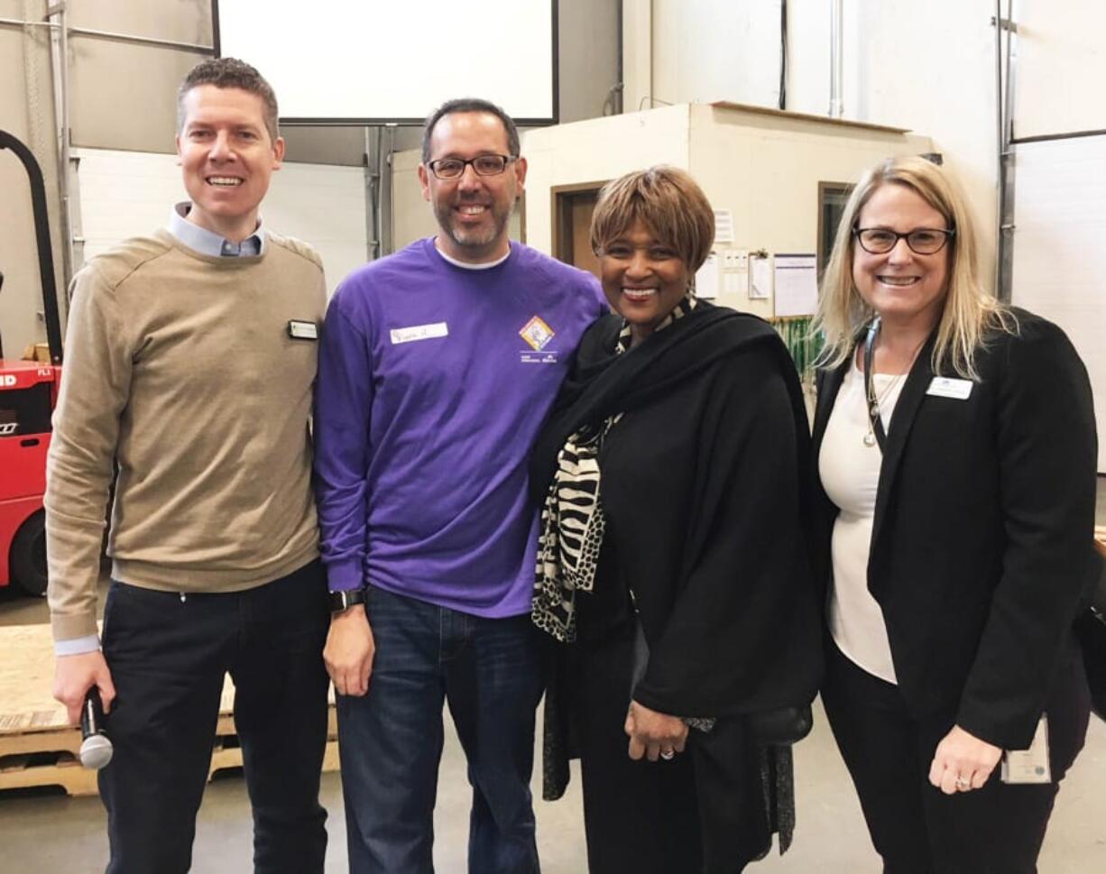 Minnehaha: About 100 Kaiser Permanente employees volunteers at the Clark County Food Bank for Kaiser Northwest’s Martin Luther King Jr. Day service event. From left: Matt Edmonds, communications manager for Clark County Food Bank, Frank Hurtarte, vice president of Human Resources for Kaiser Permanente Northwest, Ruth Brinkley, president of Kaiser Foundation Health Plan and Hospitals of the Northwest, and Tracy Dannen-Grace, director of community partnerships and philanthropy with Kaiser Permanente Northwest.