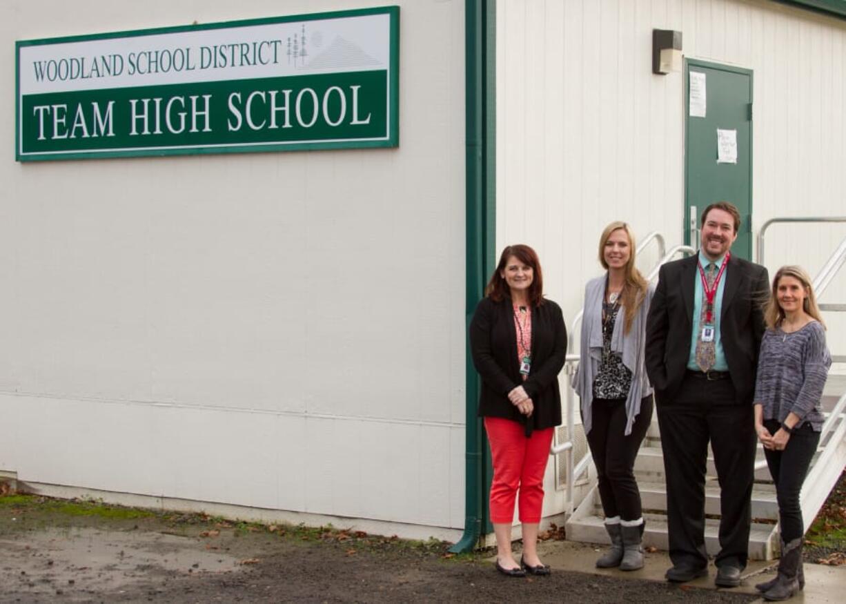 Woodland: From left: Stacy Brown, Woodland Public Schools’ business services manager, Jillian Jacobs, TEAM High School teacher, Jake Hall, executive director of learning supports and alternatives, and Stacie Crochet, local mental health provider, stand outside TEAM High School, where students can now access free mental health services thanks to federal funding.